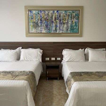 Hotel Royal Elim International Cali Exteriér fotografie A room at the hotel