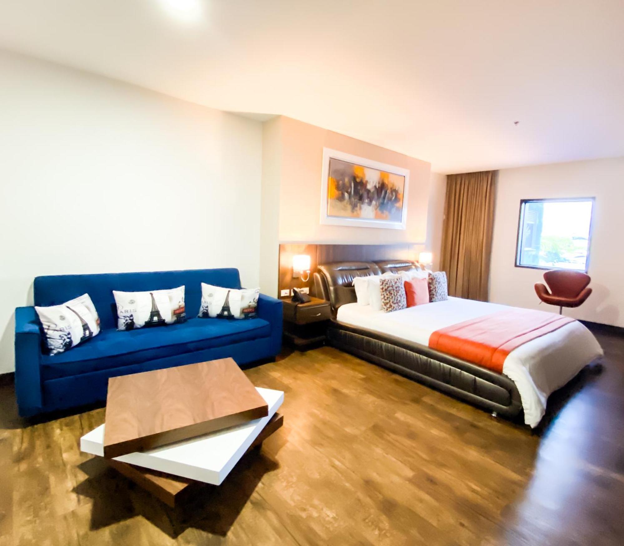 Hotel Royal Elim International Cali Exteriér fotografie A room at the hotel